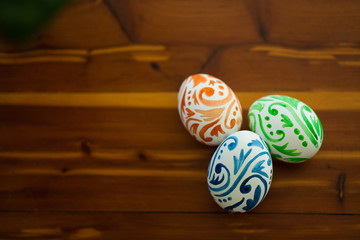 Easter eggs sitting on wooden table