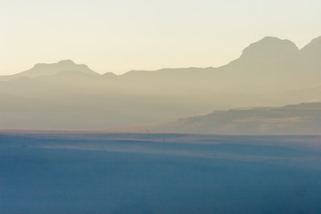 Fototapeta premium A winter fog settles over a valley in the early morning, Free state, South Africa.