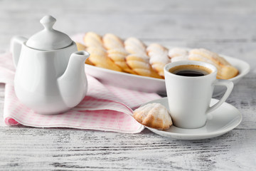 Sugar powdered madeleines on the white plate