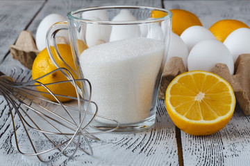 Making French butter cakes called Madeleines on a kitchen table.
