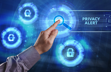Business, Technology, Internet and network concept. Young businessman working on a virtual screen of the future and sees the inscription: Privacy alert