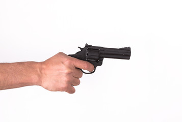 Hand with an old revolver on a white background