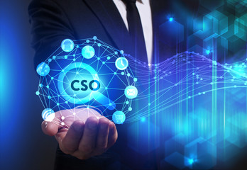 Business, Technology, Internet and network concept. Young businessman working on a virtual screen of the future and sees the inscription: CSO