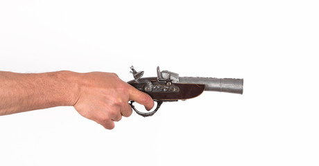 Hand with an old gun on a white background