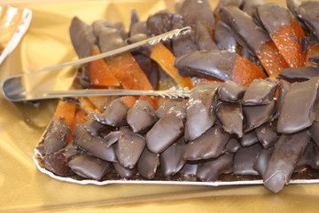 Fototapeta premium Candied orange dipped in chocolate