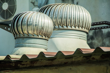 Obraz na płótnie Canvas Pumpkin fan,stainless fan,on the roof of the house.