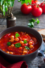 Tomato soup with chickpeas and chorizo, selective focus