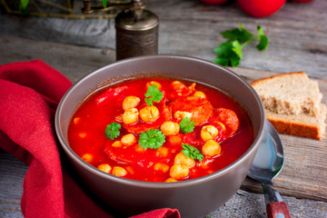 Tomato soup with chickpeas and chorizo, selective focus