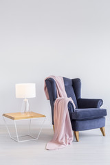 Pink blanket on armchair