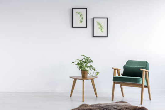 Green armchair in room