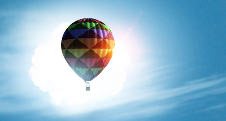 Aerostat flying above clouds . Mixed media