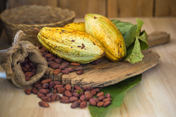 Cacao fruit, raw cacao beans, Cocoa pod on wooden background