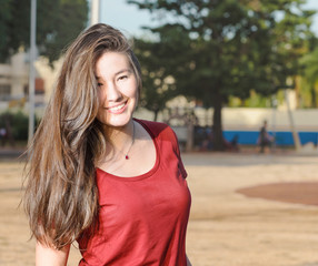 Happy woman with a cute smile lined up to the left