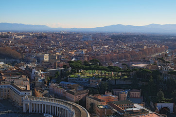 View to rooftops of Rome skyline from the top of dome Saint Peter's Basilica. Winter morning. Rome. Italy