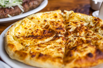 Traditional Georgian pie - khachapuri, is a cake baked in the oven with cheese
