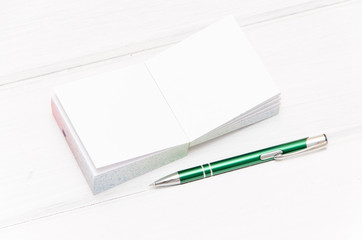 small notepad on white desk