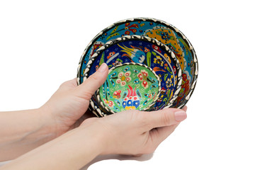 Painted plates in hands - Isolated