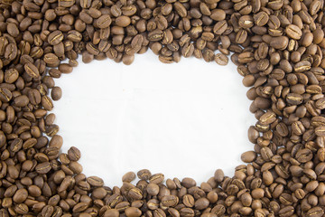 Roasted coffee beans on white background with circle copy space