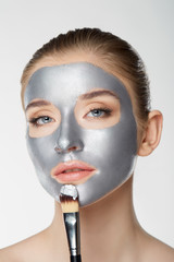 Woman portrait skin care health healthy silver mask close up white