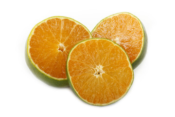 green tangerine slice isolated on white