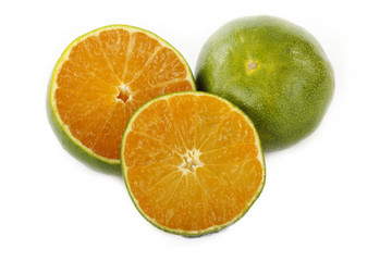 green tangerine slice isolated on white