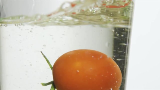 singl tomato Falling into Water