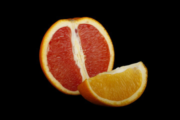 red and yellow orange slice isolated on black background