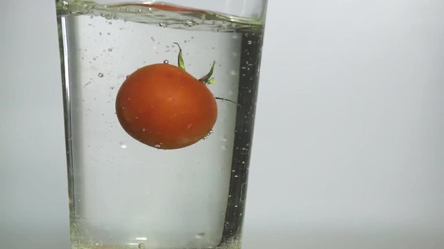 singl tomato Falling into Water