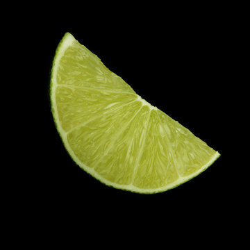 Lime Slice On Black Background Isolated