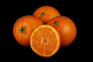 tangerines isolated on black background