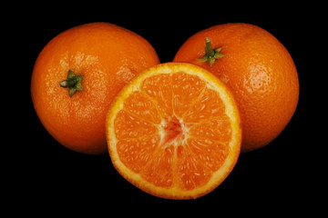 tangerines isolated on black background
