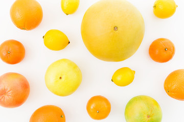 Fruit background. Citrus fruits on white background. Flat lay, top view.