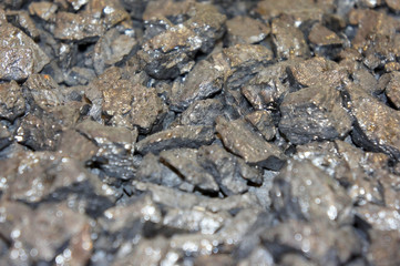 Background, texture of black coal close-up