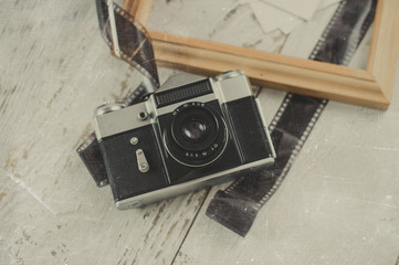 old film camera and wooden frame