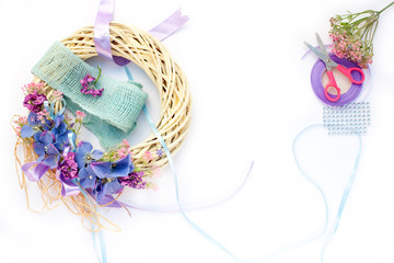 Handmade garland made of flowers and ribbons