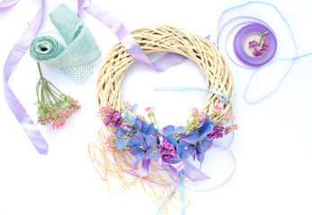 Handmade garland made of flowers and ribbons