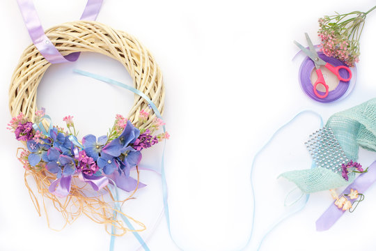 Handmade garland made of flowers and ribbons