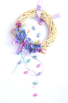 Beautiful pastel Easter Easter wreath with chocolate eggs