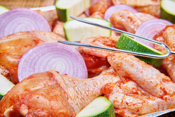 Marinated meat and vegetables prepared for grilling