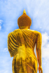 Obraz premium Golden Buddha Statue and blue sky in thai temple, Wat Phra That Khao Noi in Nan province, Northern of Thailand