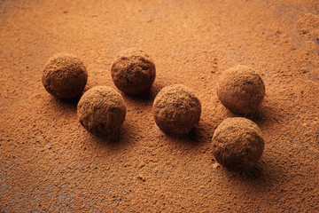 Chocolate truffle,Truffle chocolate candies with cocoa powder.Homemade fresh energy balls with chocolate.Gourmet assorted truffles made by chocolatier.Chunks of chocolate and coffee beans