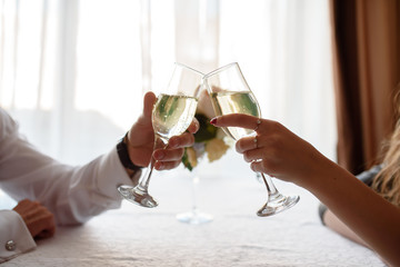 hand making toast with glass