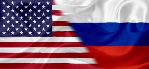 Fototapeta premium Waving flags of United States of America and Russia with fabric texture