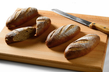 small loaf on a cutting Board with a knife.