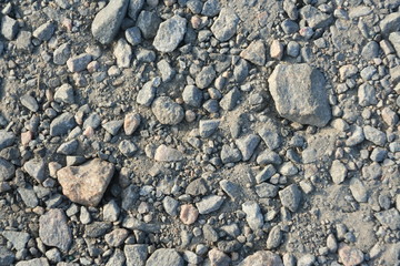 Crushed grey stone on the ground texture background