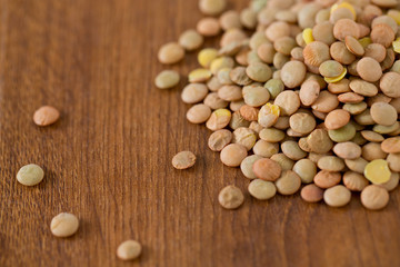 lentils on wooden surface