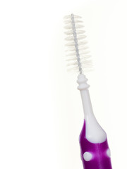 Woman holding toothbrush special for braces