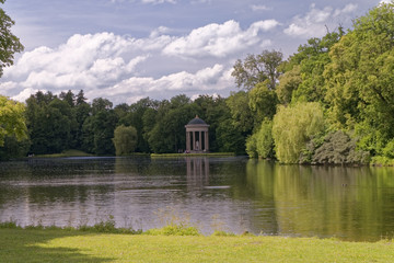 Fototapeta na wymiar Greek temple in the park by the lake