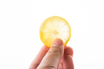 hand with lemon fruit isolated on white background