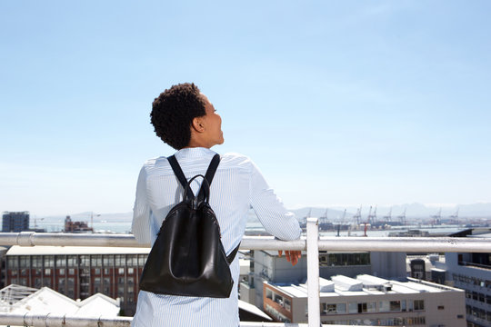 Behind Of Young Woman Looking At City